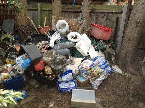 Photograph showing garden waste and tools